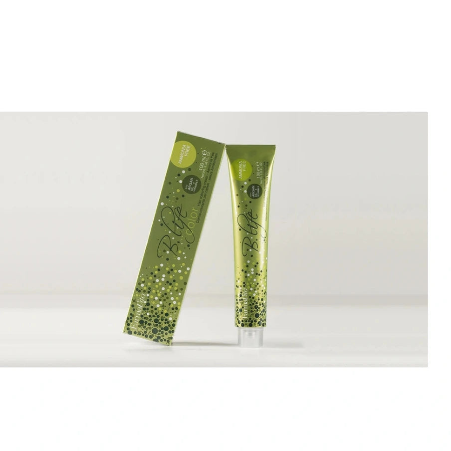 A green cosmetic tube and matching rectangular box with a glittery green gradient design, photographed on a clean white studio background.