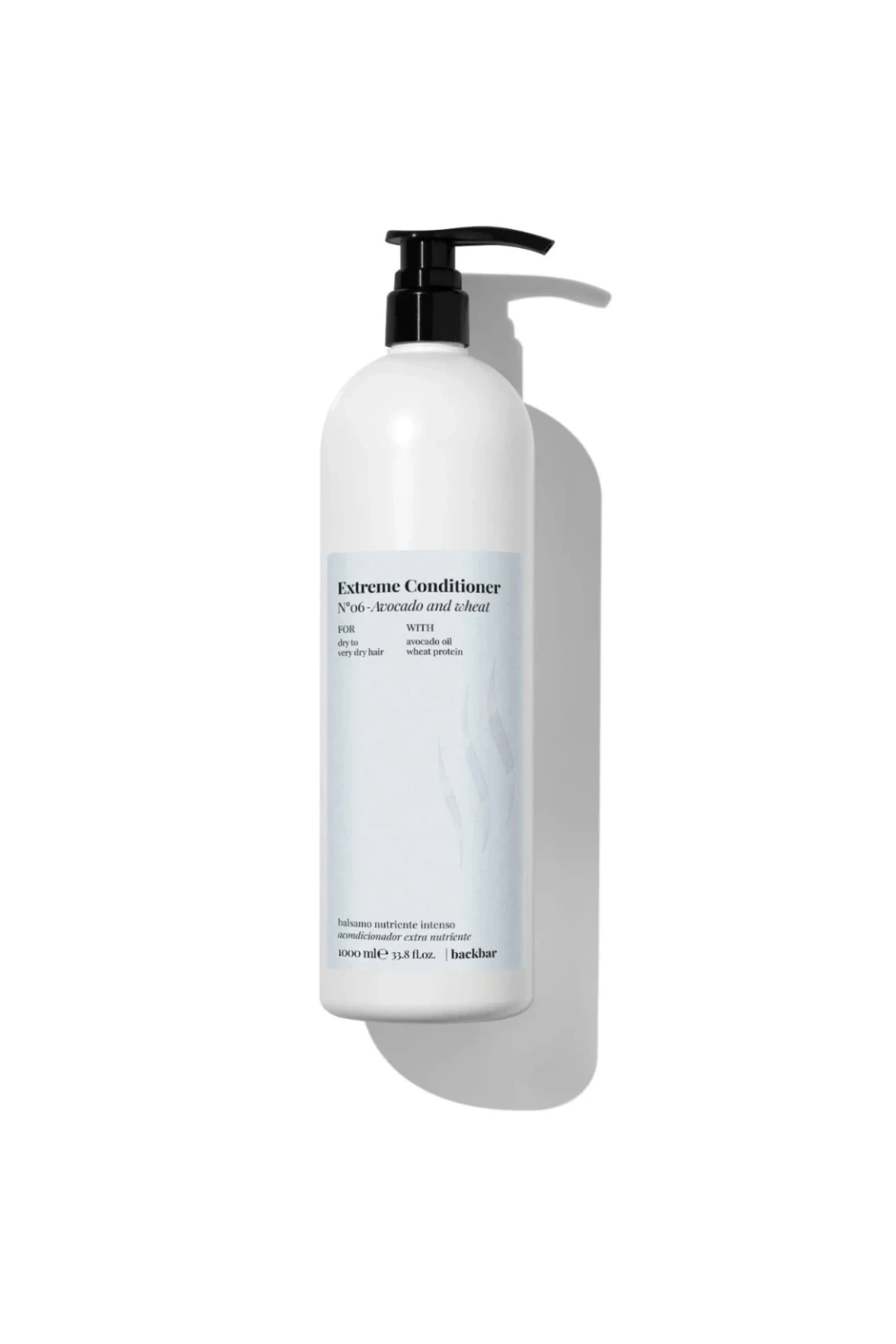 A tall white bottle of hair conditioner with a black pump dispenser and a minimalist label, shown on a clean white background with a soft shadow.