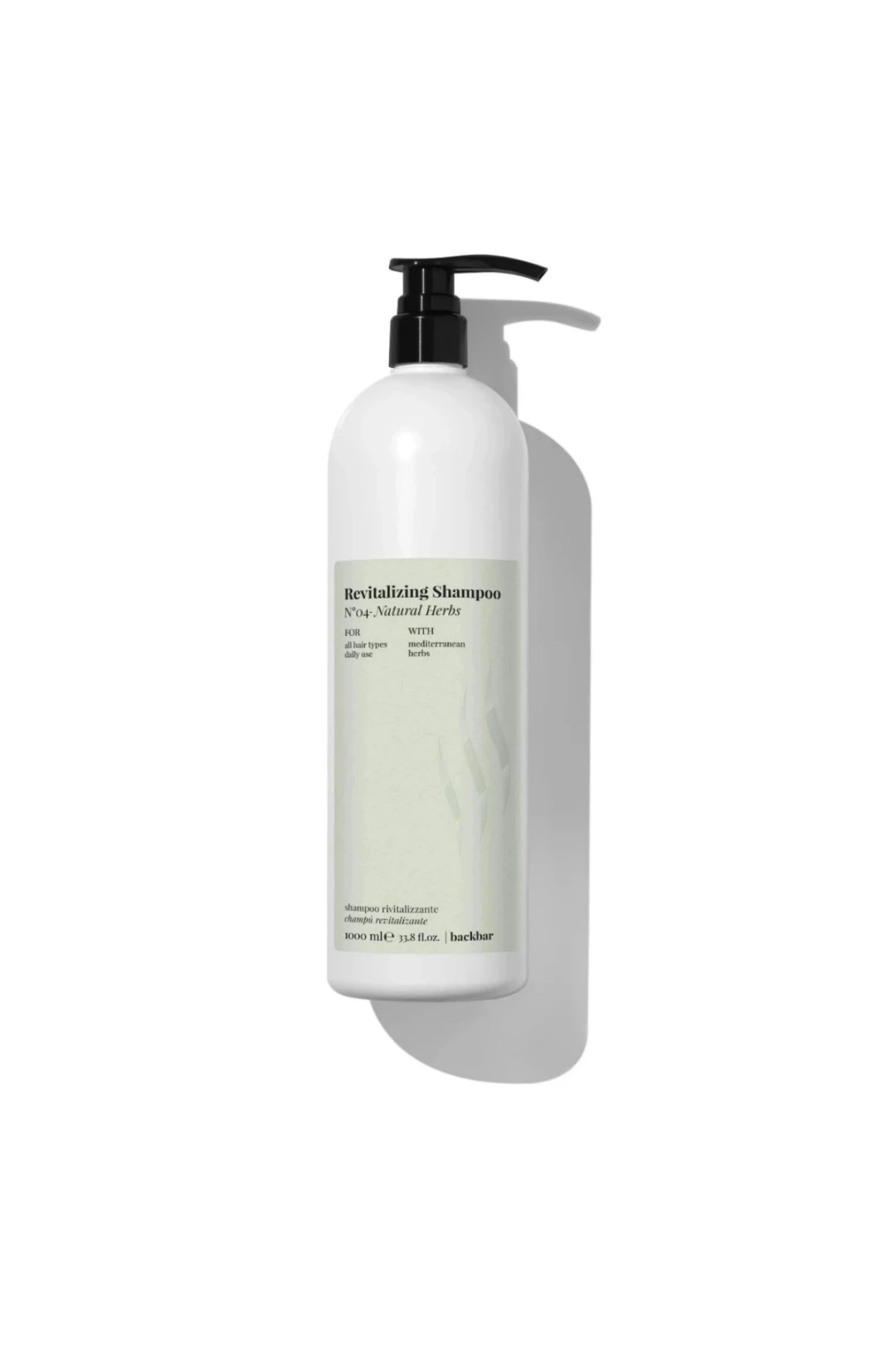 A 1000 ml bottle of Backbar Revitalizing Shampoo in 'Pink' on a clean white background with a soft shadow.