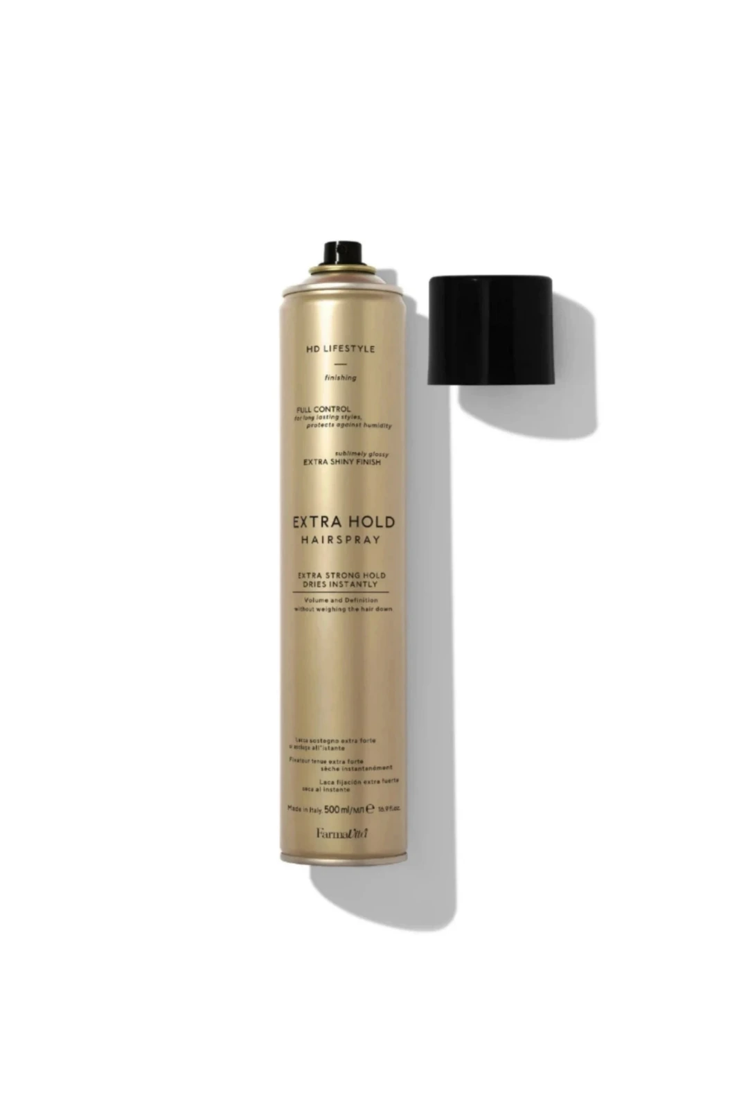A tall metallic gold aerosol hairspray can with a black cap placed beside it on a clean white background. The can is labeled 'Fumaguru Extra Hold Hairspray' and includes additional text such as 'HD Lifestyle' and 'Full Control.