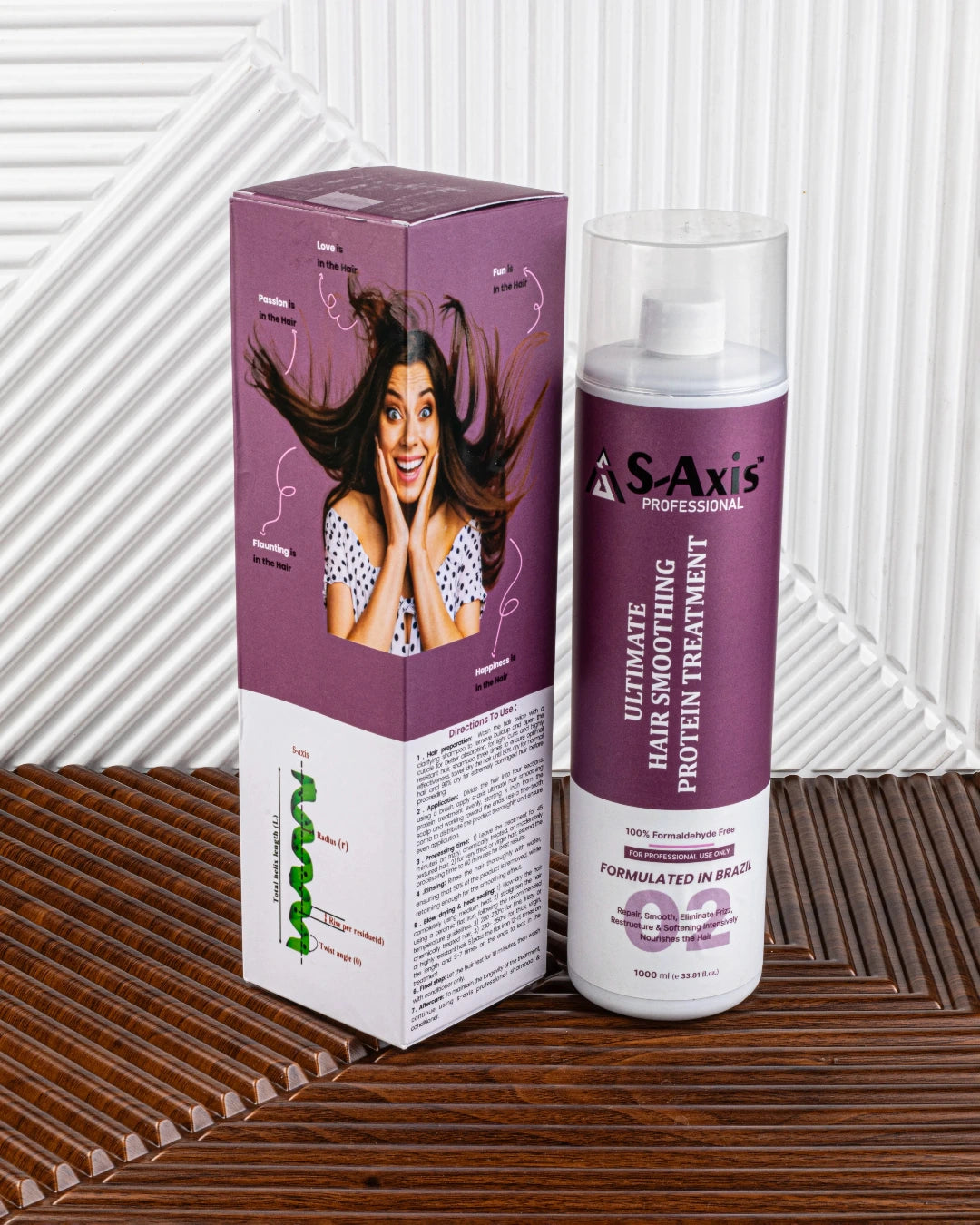 S-Axis Professional Ultimate Hair Smoothing Protein Treatment bottle and its purple and white packaging box, displayed on a brown woven mat against a white slatted background.