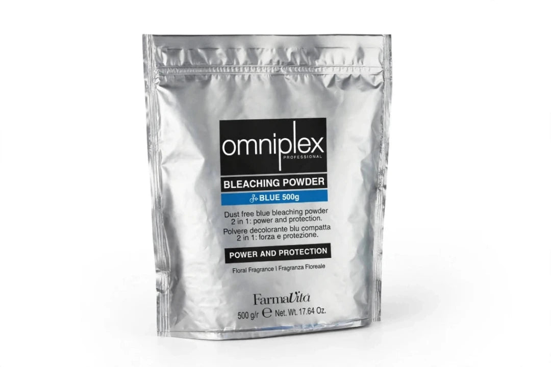 A silver resealable pouch of Omniplex Bleaching Powder in the shade Blue, 500g, on a clean white background.